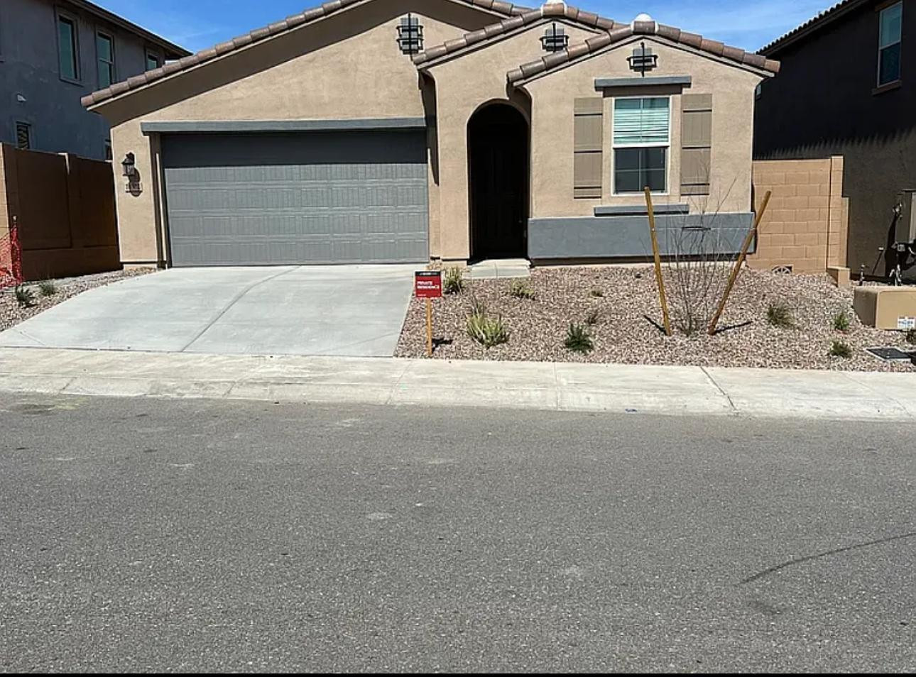 a front view of a house with yard