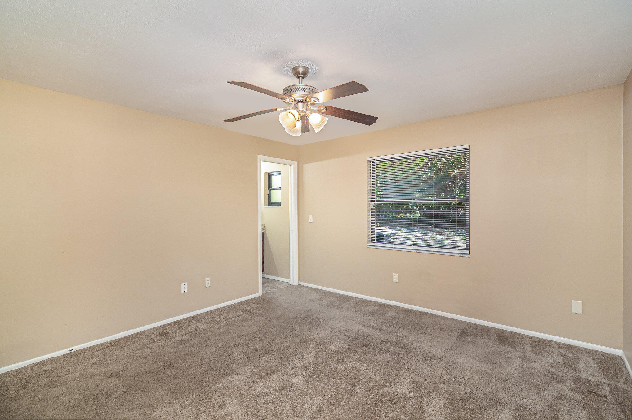 635 Croton Road Melbourne, FL 32935 - Photo 15 of 22 a view of an empty room with a window