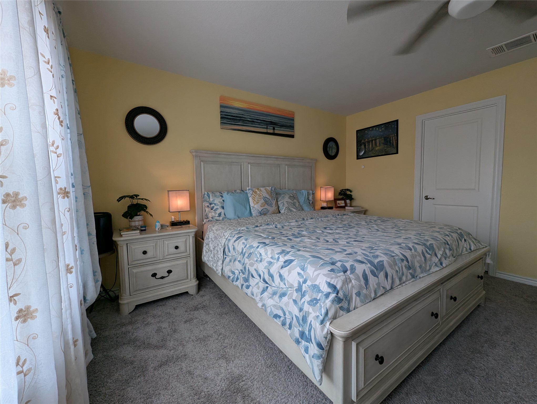 14502 McCoy Loop Austin, TX 78717 - Photo 13 of 26 Bedroom featuring light yellow walls and gray carpeting