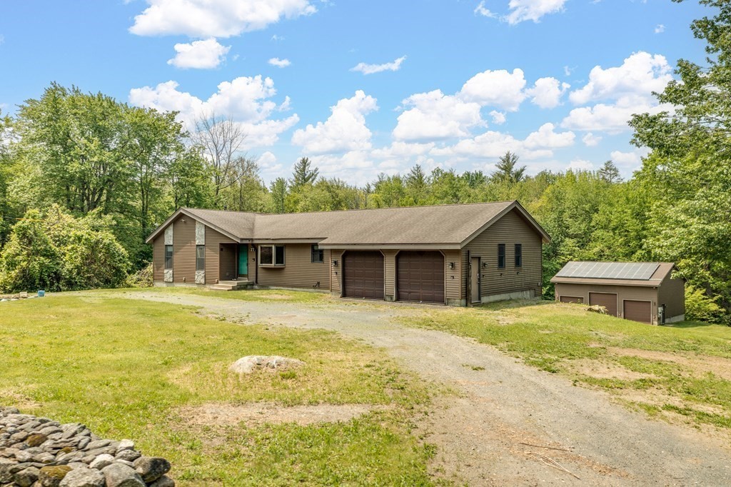 77 Edwards Road Westhampton, MA 01027 - Photo 4 of 42 a front view of a house with a garden