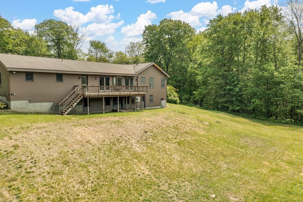 77 Edwards Road Westhampton, MA 01027 - Photo 5 of 42 a front view of a house with a yard