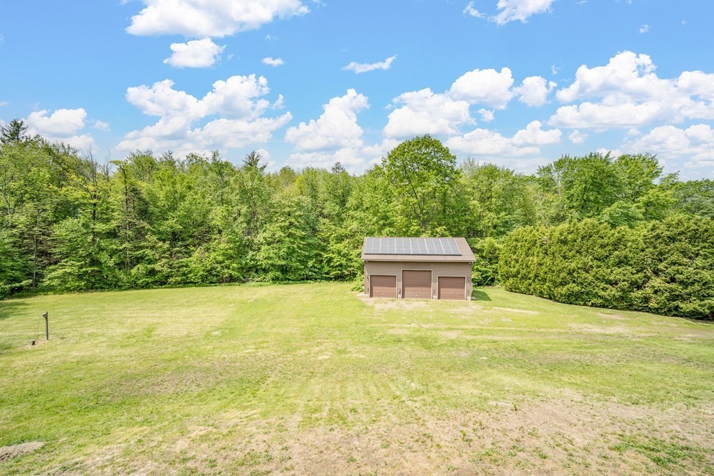 77 Edwards Road Westhampton, MA 01027 - Photo 8 of 42 a house view with swimming pool and trees in the background
