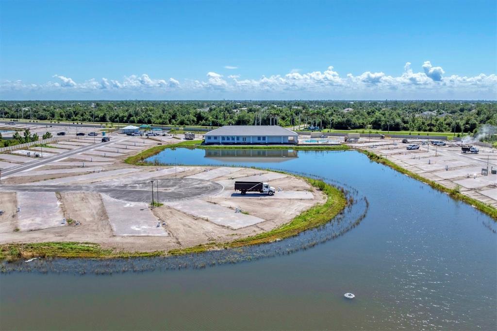9001 Gasparilla Road, Unit 42 Placida, FL 33946 - Photo 59 of 75 a view of a swimming pool with an outdoor space and seating