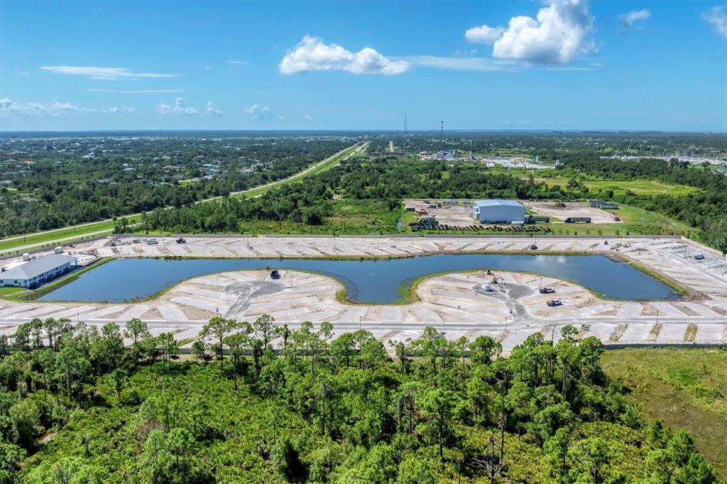 9001 Gasparilla Road, Unit 42 Placida, FL 33946 - Photo 61 of 75 an aerial view of a house with a swimming pool outdoor seating and yard