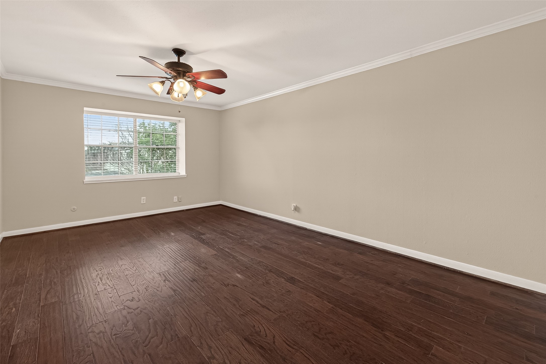 11550 Chimney Rock Road, Unit 330 Houston, TX 77035 - Photo 19 of 30 Primary bedroom with a ceiling fan.