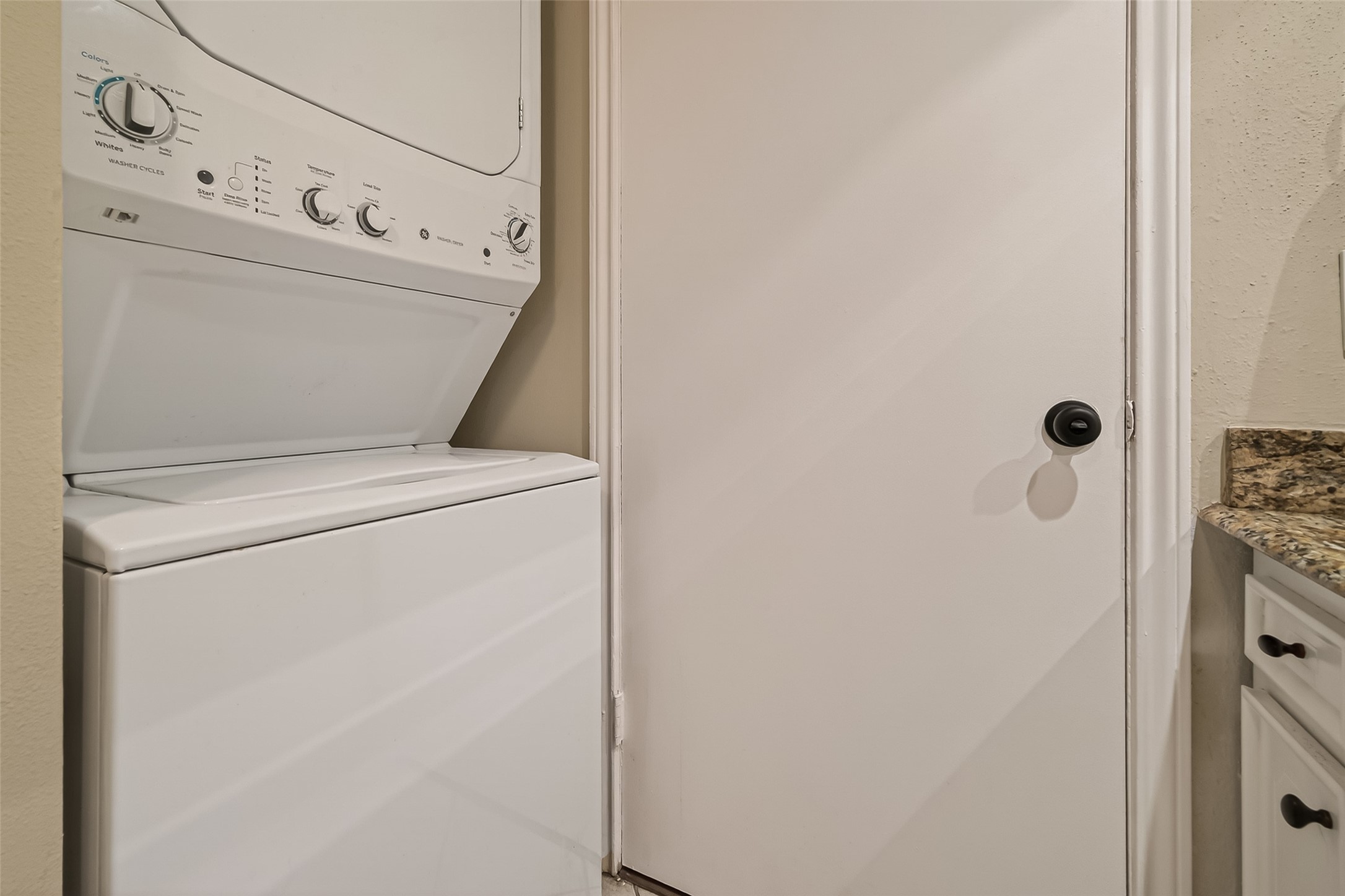 11550 Chimney Rock Road, Unit 330 Houston, TX 77035 - Photo 23 of 30 Stacked washer and dryer.