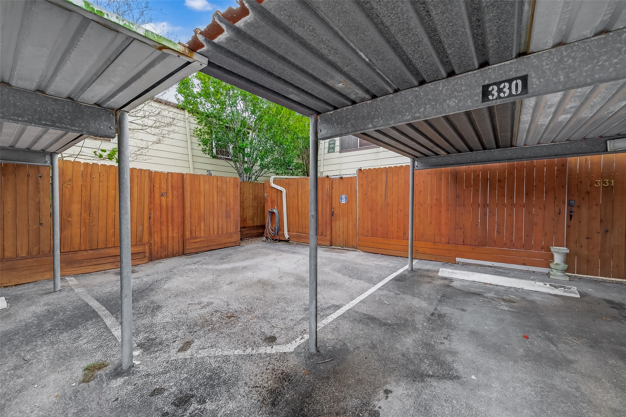 11550 Chimney Rock Road, Unit 330 Houston, TX 77035 - Photo 28 of 30 Parking spot steps outside patio gate.