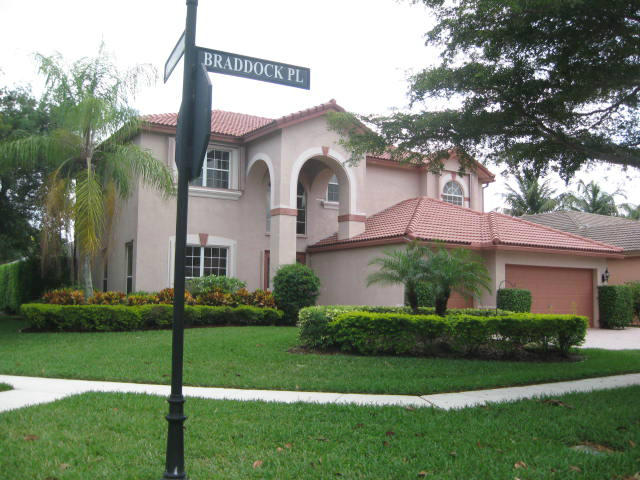 22194 Braddock Place Boca Raton, FL 33428 - Photo 2 of 20 a front view of a house with a garden