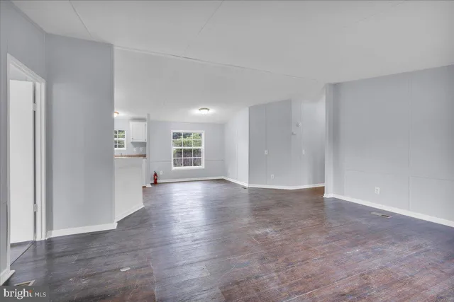 a view of a kitchen with a sink and a window