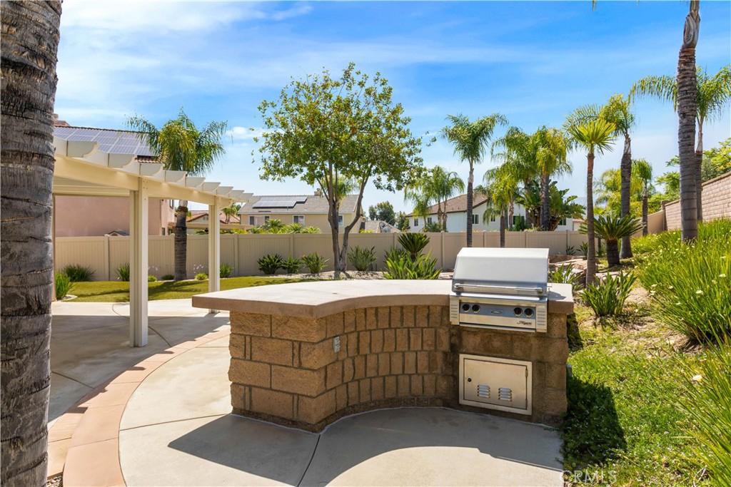 33351 Nicholas Common Temecula, CA 92592 - Photo 31 of 42 a view of a backyard with plants and outdoor seating