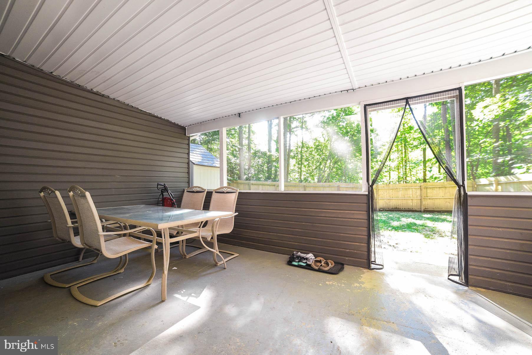 327 Maverick Road Lusby, MD 20657 - Photo 29 of 37 Large screened porch