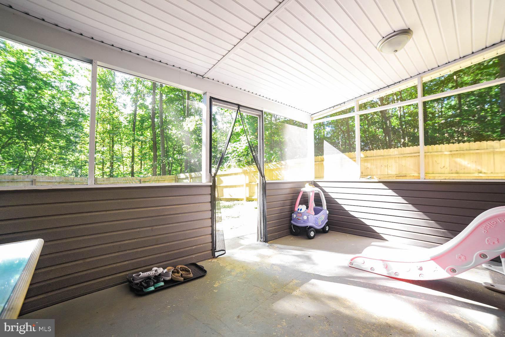 327 Maverick Road Lusby, MD 20657 - Photo 30 of 37 Large screened porch