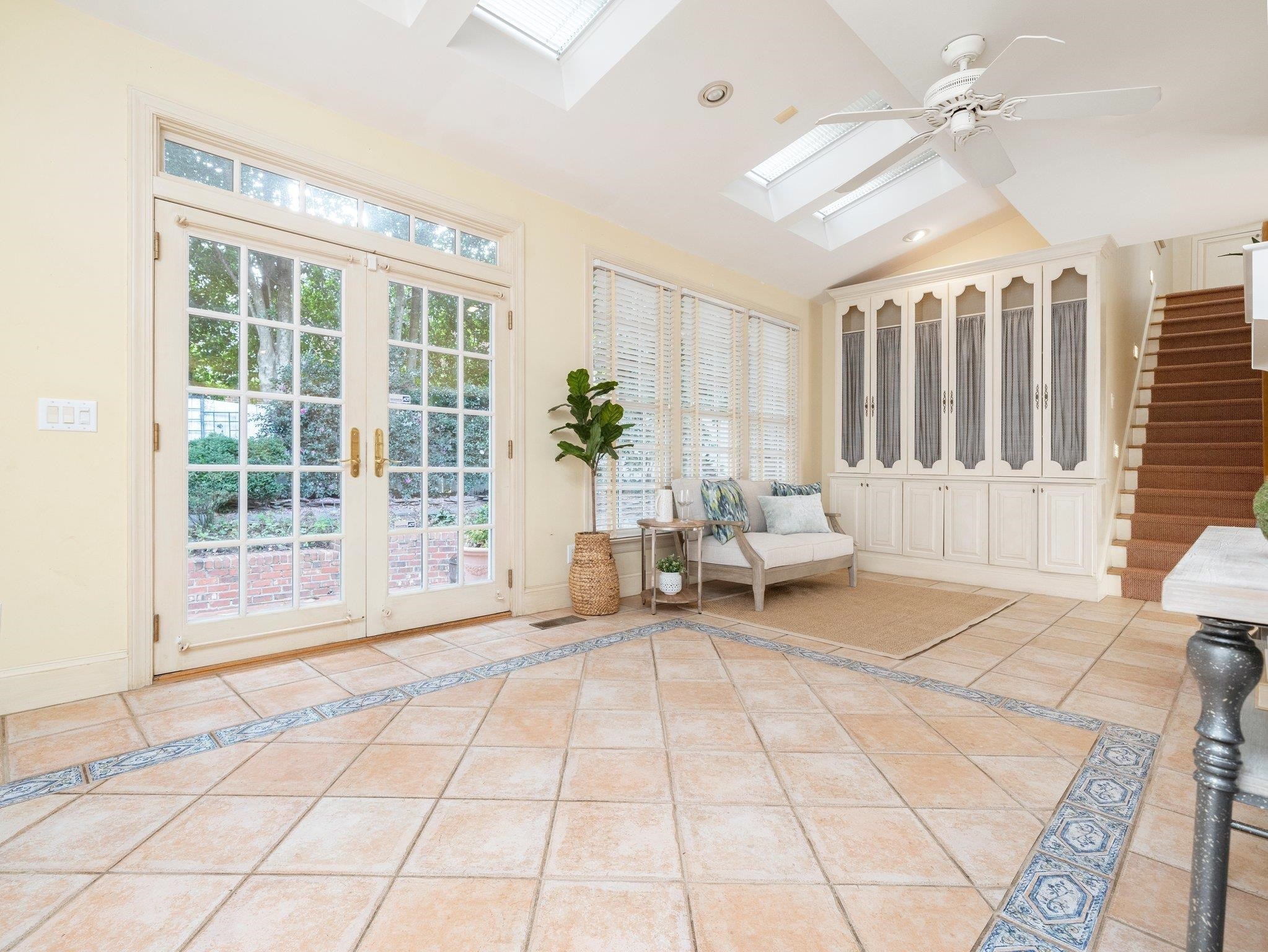 1404 Dogwood Lane Raleigh, NC 27607 - Photo 11 of 47 Bright Loggia - skylights feature power blinds