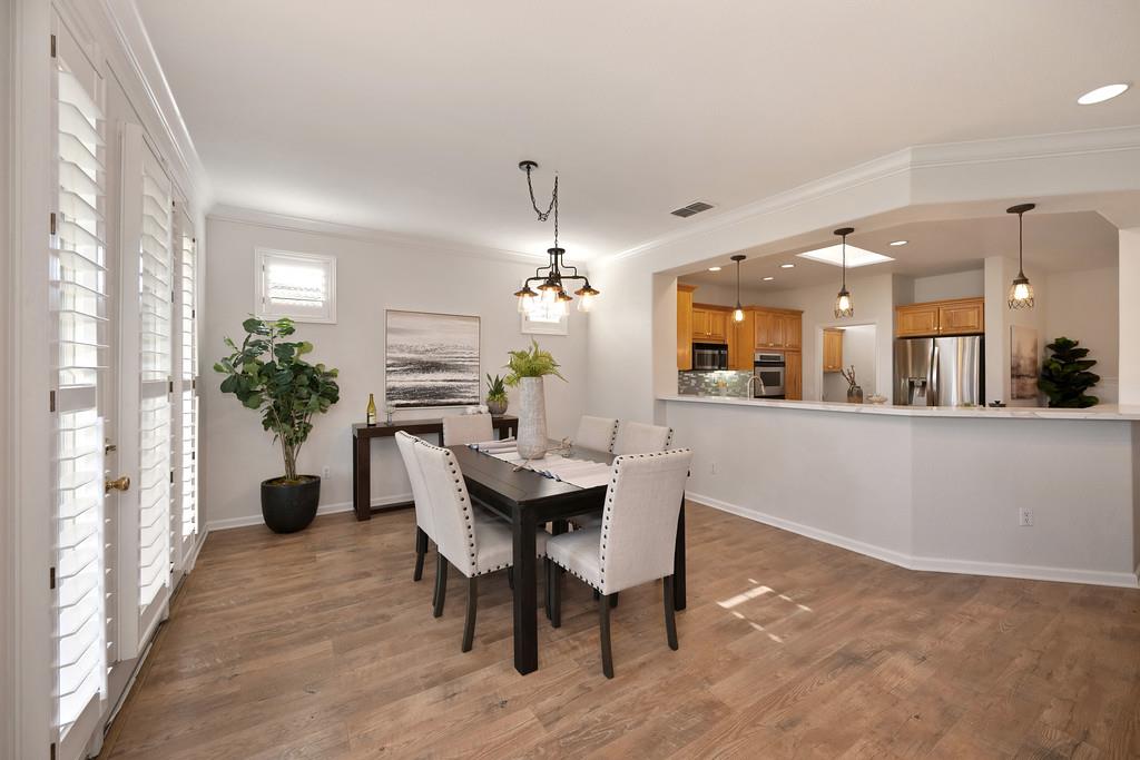 6014 Timberlodge Lane Roseville, CA 95747 - Photo 11 of 63 a dining room with furniture and wooden floor