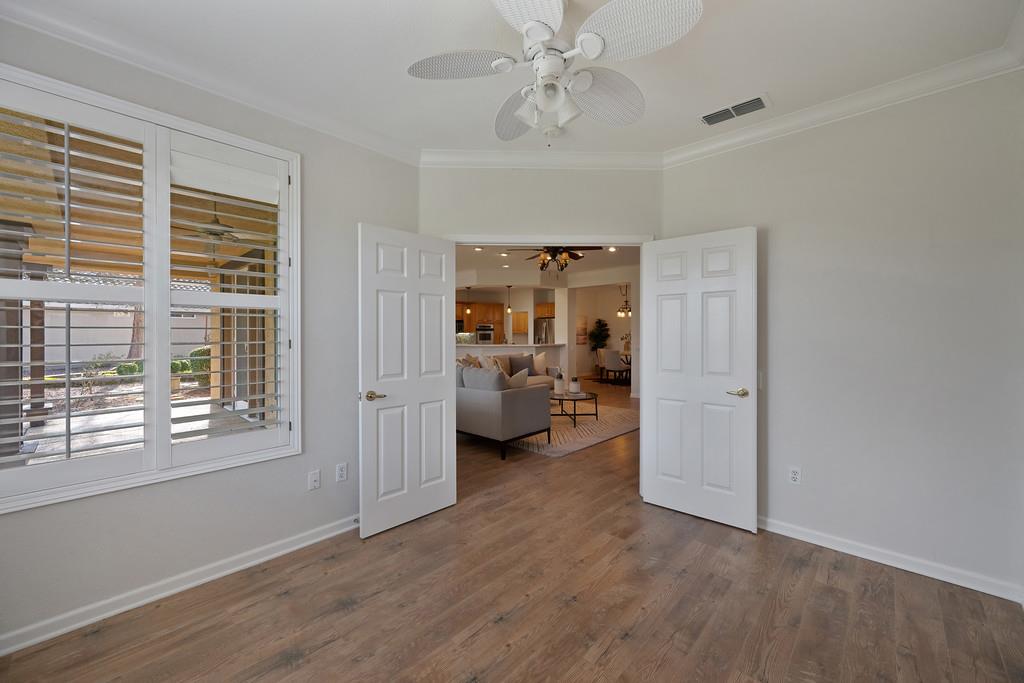 6014 Timberlodge Lane Roseville, CA 95747 - Photo 23 of 63 a view of a livingroom with furniture hardwood floor and workspace