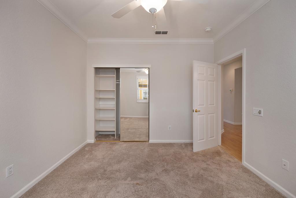 6014 Timberlodge Lane Roseville, CA 95747 - Photo 25 of 63 an empty room with a ceiling fan