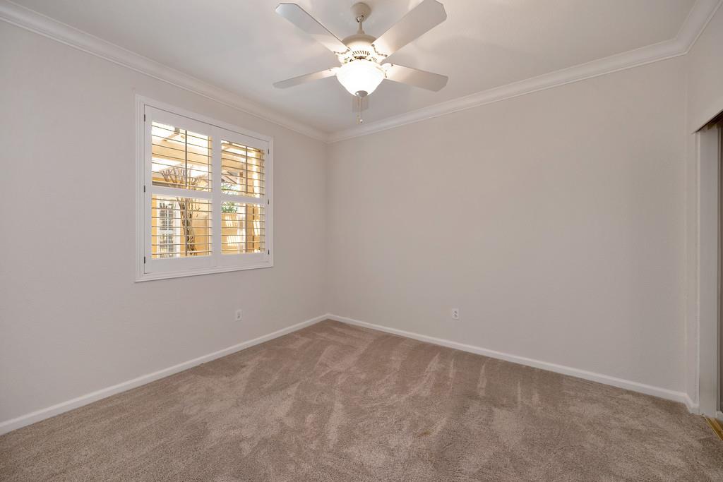 6014 Timberlodge Lane Roseville, CA 95747 - Photo 26 of 63 an empty room with a window and a fan