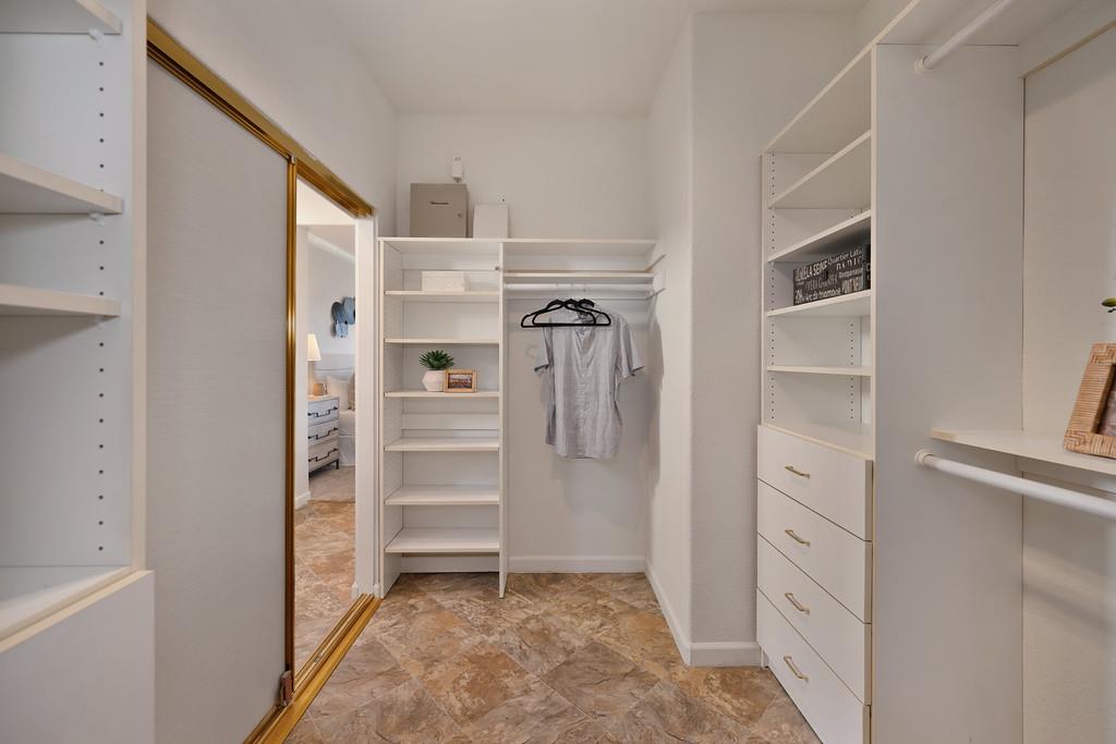 6014 Timberlodge Lane Roseville, CA 95747 - Photo 37 of 63 a view of walk in closet with clothes