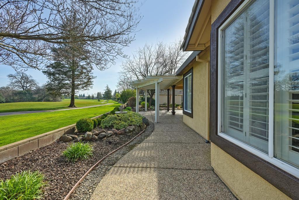 6014 Timberlodge Lane Roseville, CA 95747 - Photo 51 of 63 a view of a house with backyard and garden