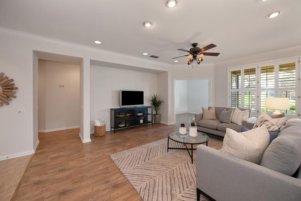 6014 Timberlodge Lane Roseville, CA 95747 - Photo 8 of 63 a living room with furniture a ceiling fan and a flat screen tv