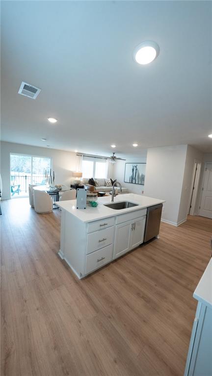 200 Harrell Way Fayetteville, GA 30215 - Photo 4 of 14 a large white kitchen with kitchen island a sink a stove a refrigerator with white cabinets and wooden floor