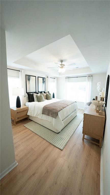 200 Harrell Way Fayetteville, GA 30215 - Photo 6 of 14 a spacious bedroom with a bed and a couch