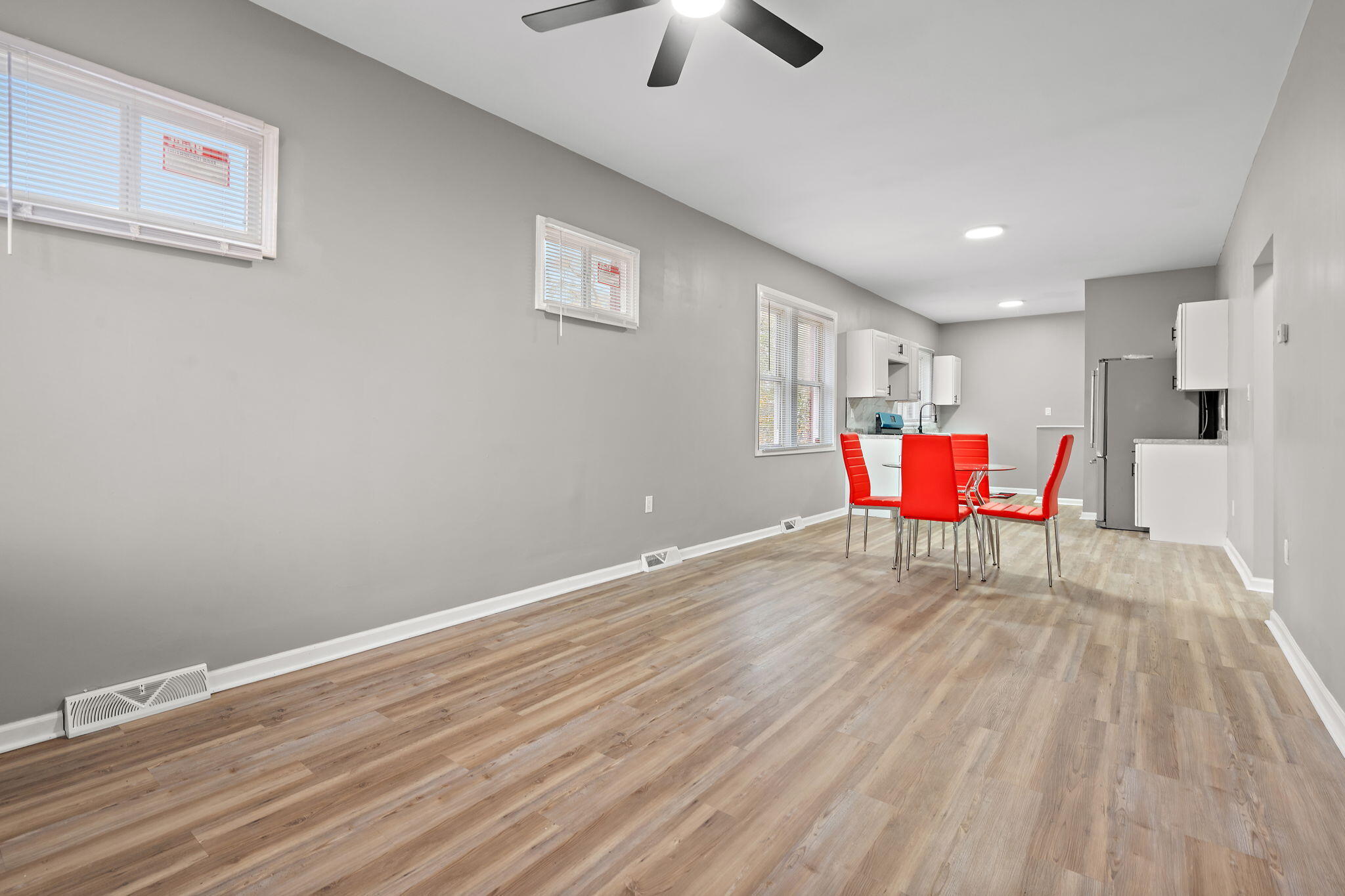 1335 Williams Street Gary, IN 46404 - Photo 5 of 22 a room with furniture a chandelier fan and windows