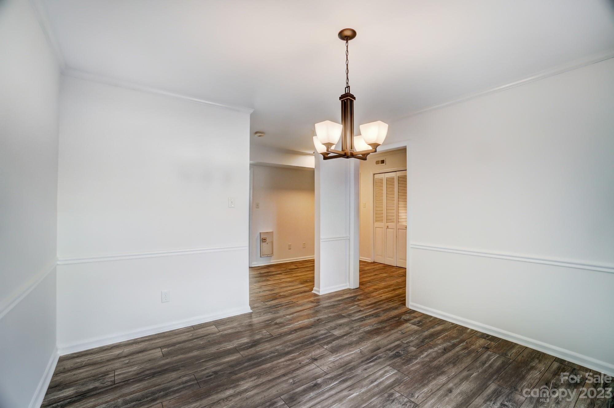 3500 Colony Road, Unit E Charlotte, NC 28211 - Photo 16 of 37 a view of empty room with wooden floor
