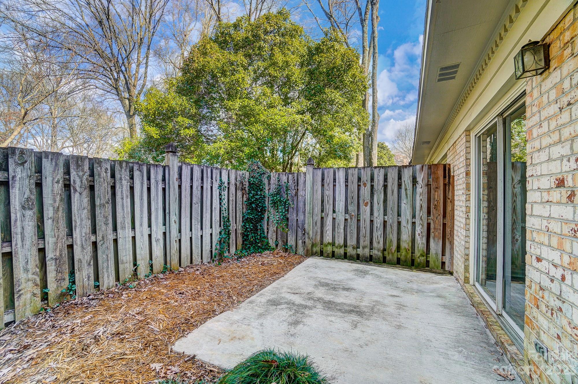 3500 Colony Road, Unit E Charlotte, NC 28211 - Photo 19 of 37 a view of small yard with wooden fence