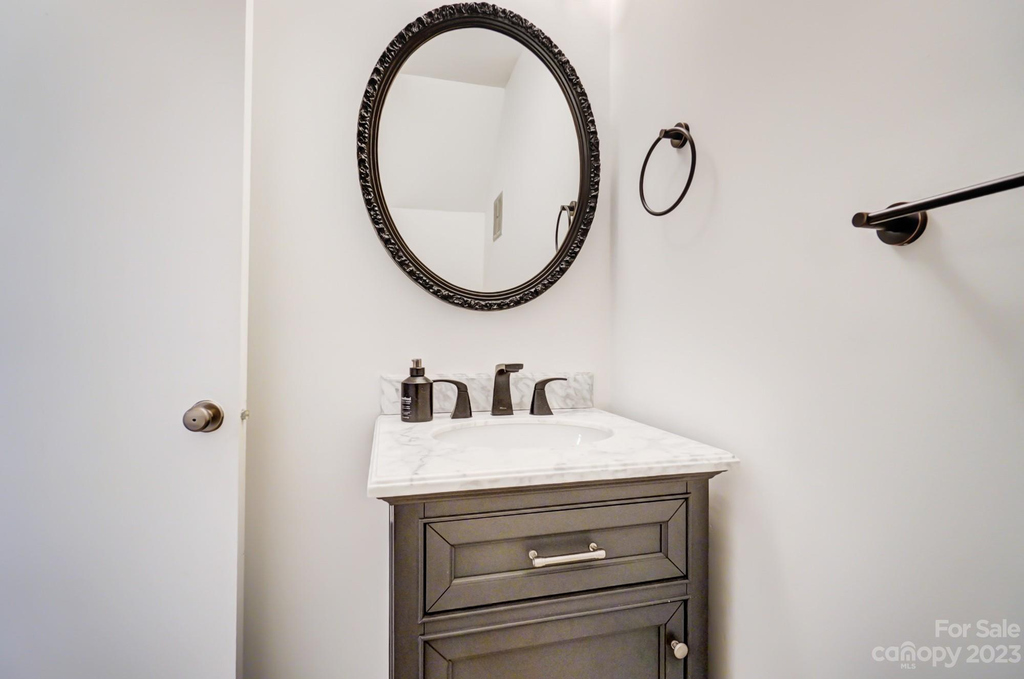 3500 Colony Road, Unit E Charlotte, NC 28211 - Photo 21 of 37 a bathroom with a sink and a mirror