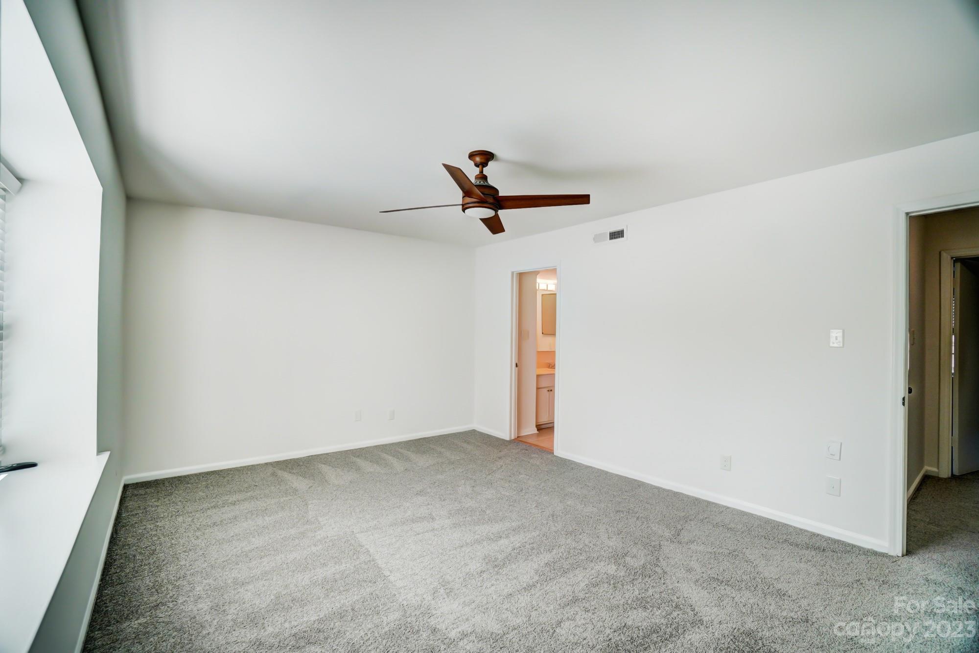 3500 Colony Road, Unit E Charlotte, NC 28211 - Photo 25 of 37 a view of a room with a ceiling fan