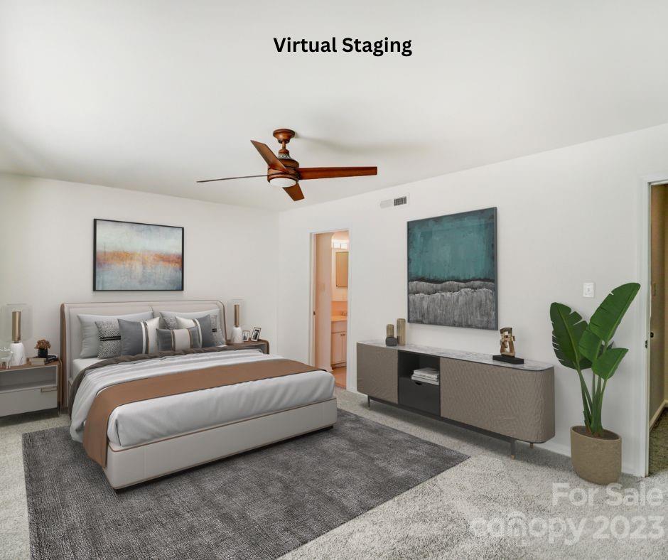 3500 Colony Road, Unit E Charlotte, NC 28211 - Photo 26 of 37 a bedroom with a balcony a bed and a couch