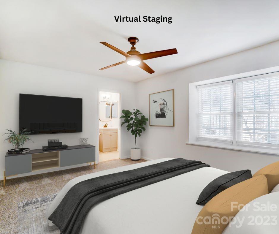 3500 Colony Road, Unit E Charlotte, NC 28211 - Photo 29 of 37 a bedroom with a bed window and flat screen tv