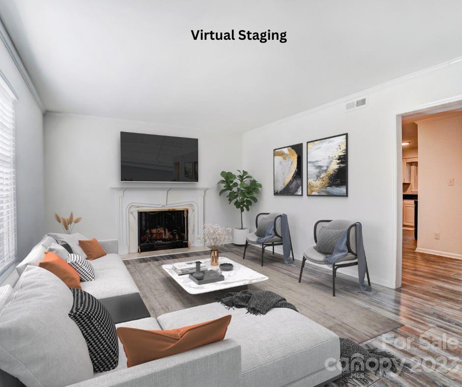 3500 Colony Road, Unit E Charlotte, NC 28211 - Photo 4 of 37 a living room with furniture a flat screen tv and a fireplace