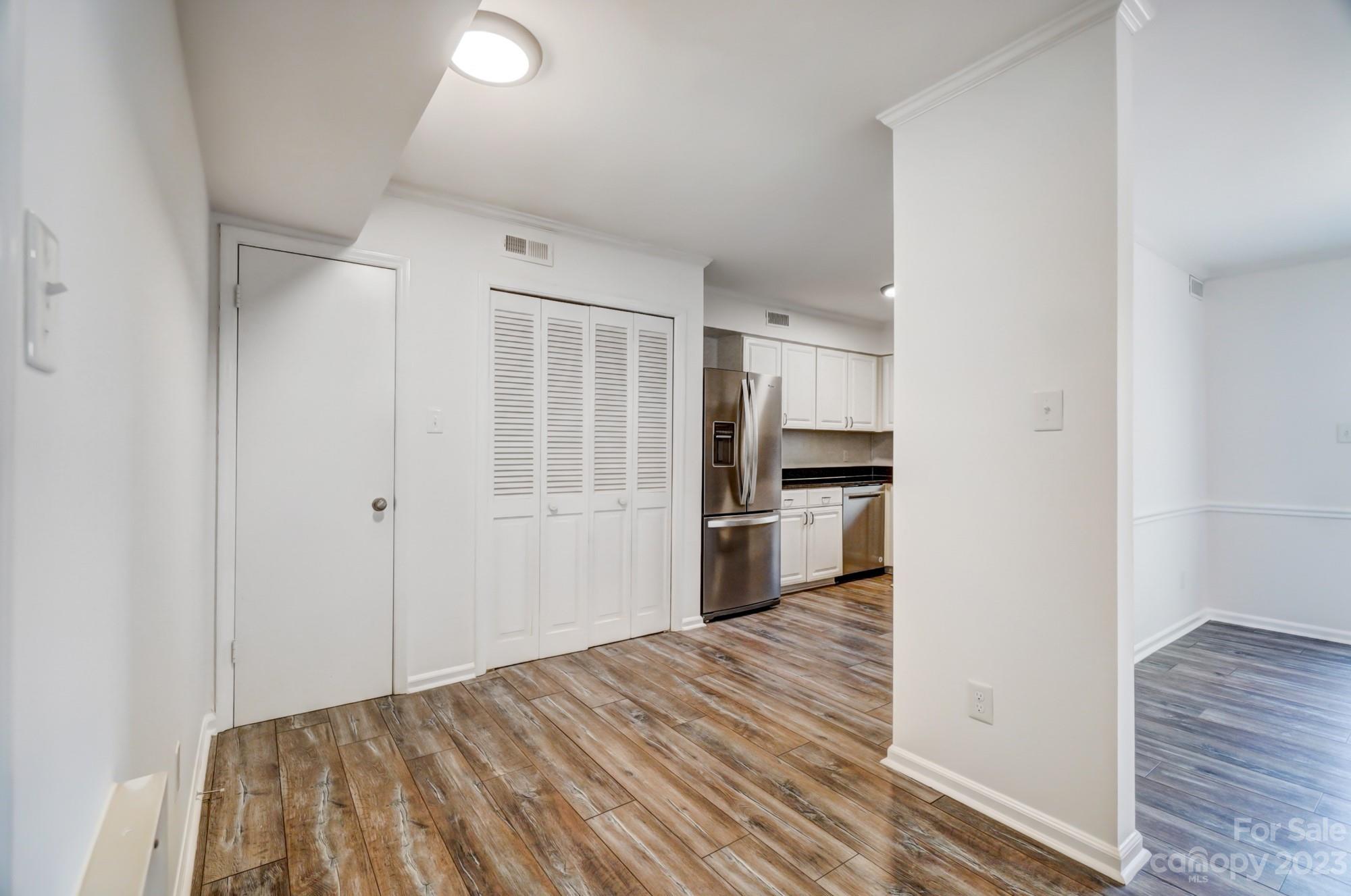 3500 Colony Road, Unit E Charlotte, NC 28211 - Photo 7 of 37 a bedroom with a bed and a view of kitchen