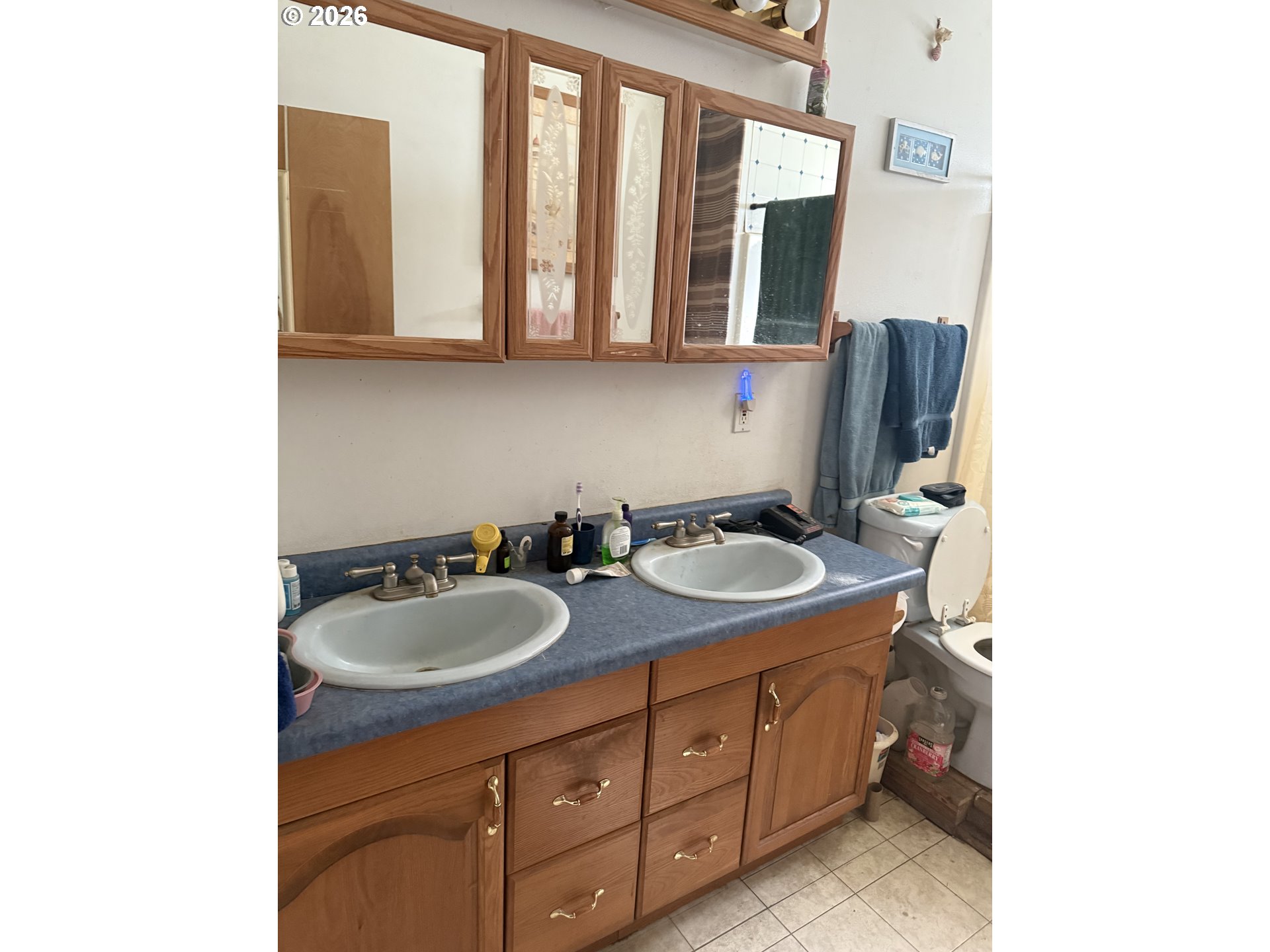 74861 Conifer Court Cottage Grove, OR 97424 - Photo 4 of 7 a bathroom with a granite countertop sink and a mirror
