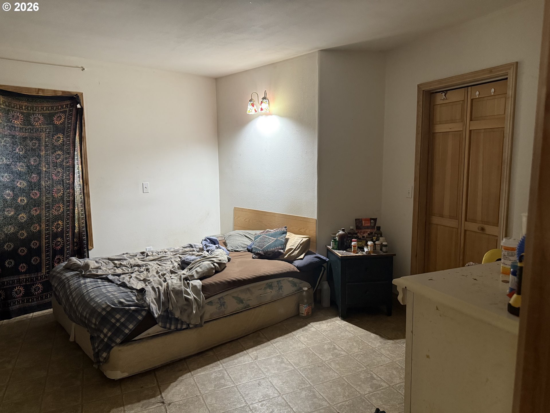 74861 Conifer Court Cottage Grove, OR 97424 - Photo 5 of 7 a bedroom with a bed and a mirror