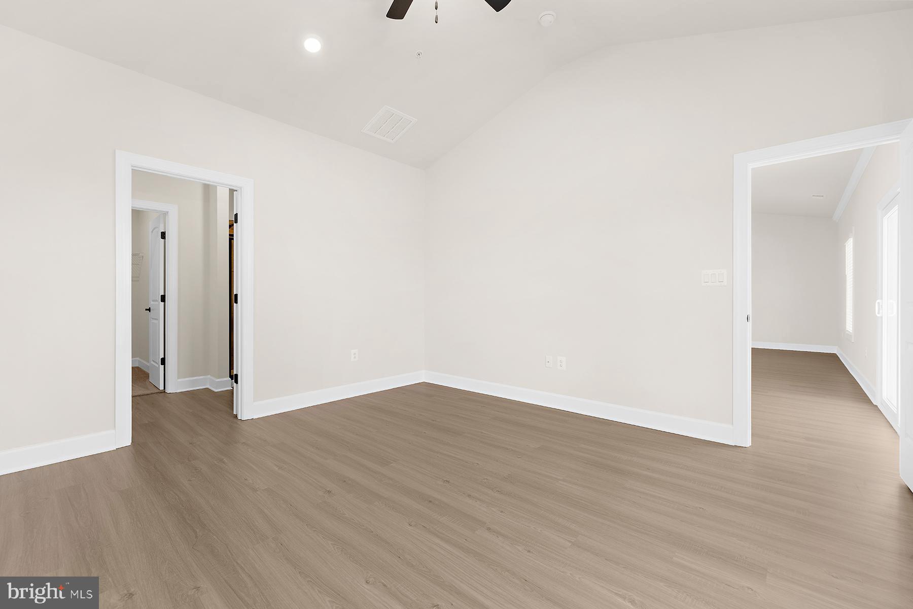5211 McCormick Avenue Baltimore, MD 21206 - Photo 13 of 20 a view of an empty room with wooden floor and closet