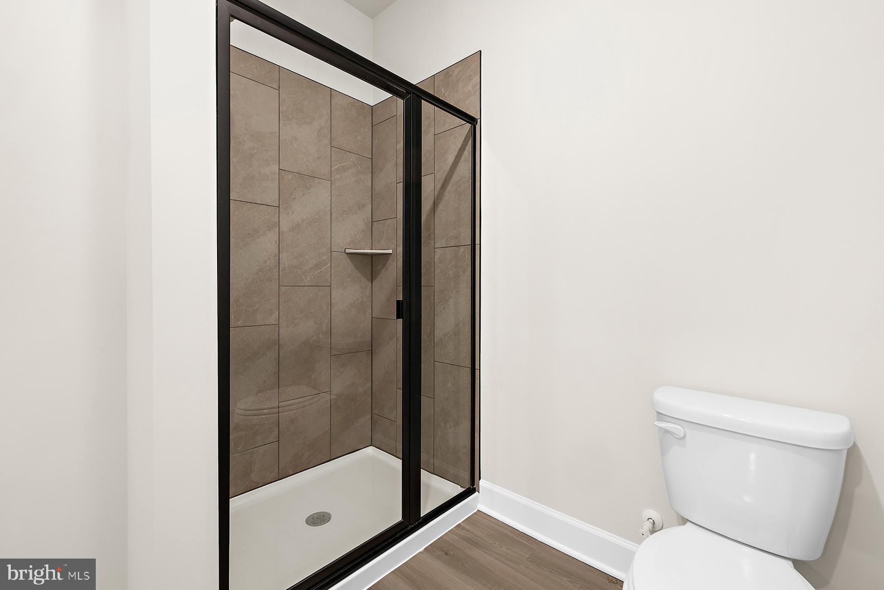 5211 McCormick Avenue Baltimore, MD 21206 - Photo 15 of 20 a bathroom with a shower and toilet