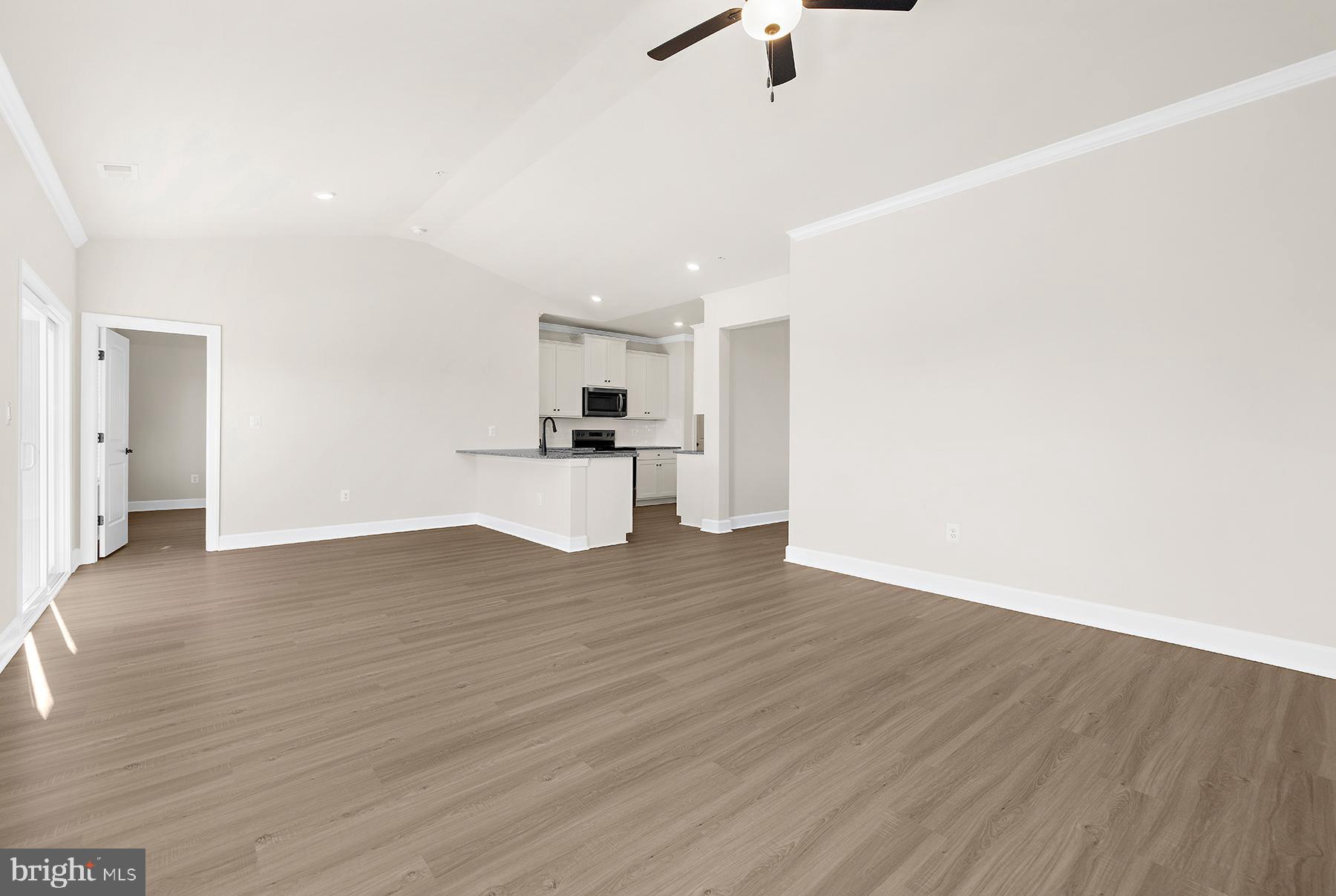 5211 McCormick Avenue Baltimore, MD 21206 - Photo 20 of 20 a view of empty room with wooden floor