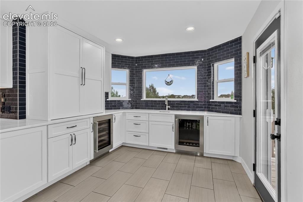 11662 Rio Secco Road Peyton, CO 80831 - Photo 8 of 29 Walk-out wet bar w/ dual wine fridges