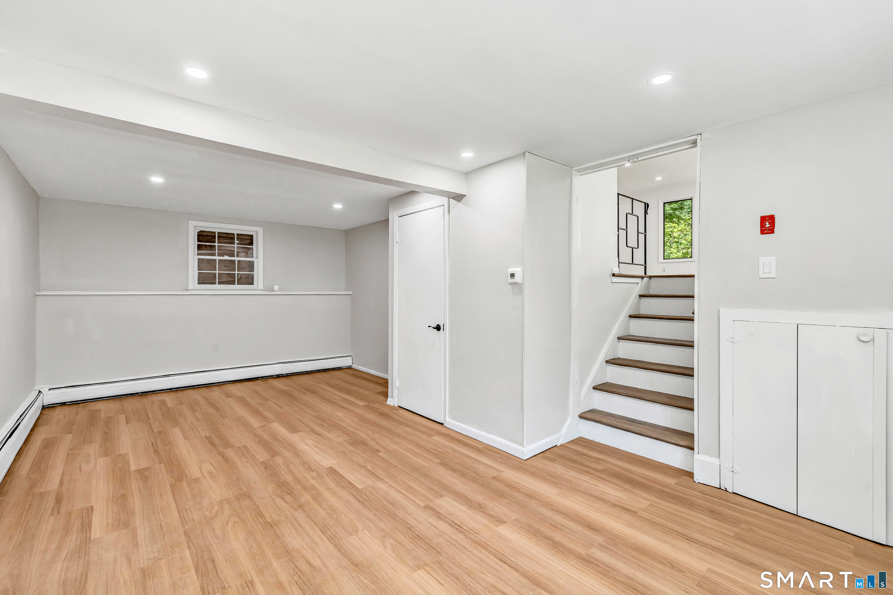 48 Crestwood Road Monroe, CT 06468 - Photo 29 of 32 wooden floor in an empty room with a window