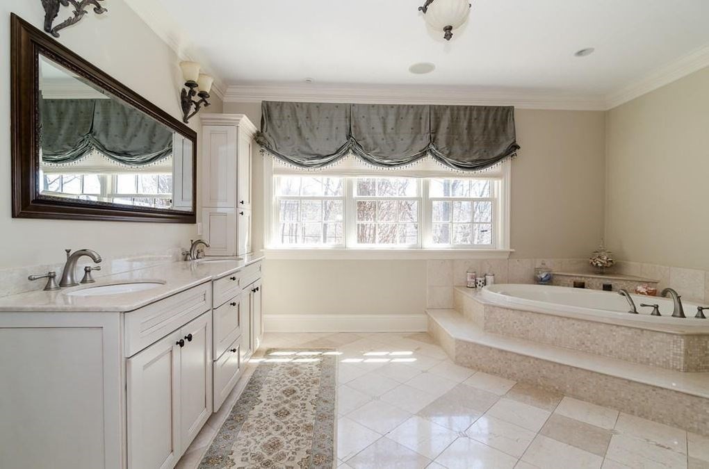 56 Sears Road Southborough, MA 01772 - Photo 11 of 26 a bathroom with a sink mirror and a bathtub