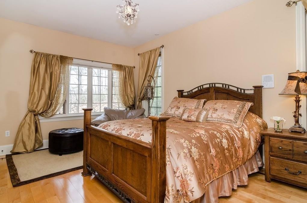 56 Sears Road Southborough, MA 01772 - Photo 15 of 26 a bedroom with a bed and a flat tv screen on dresser