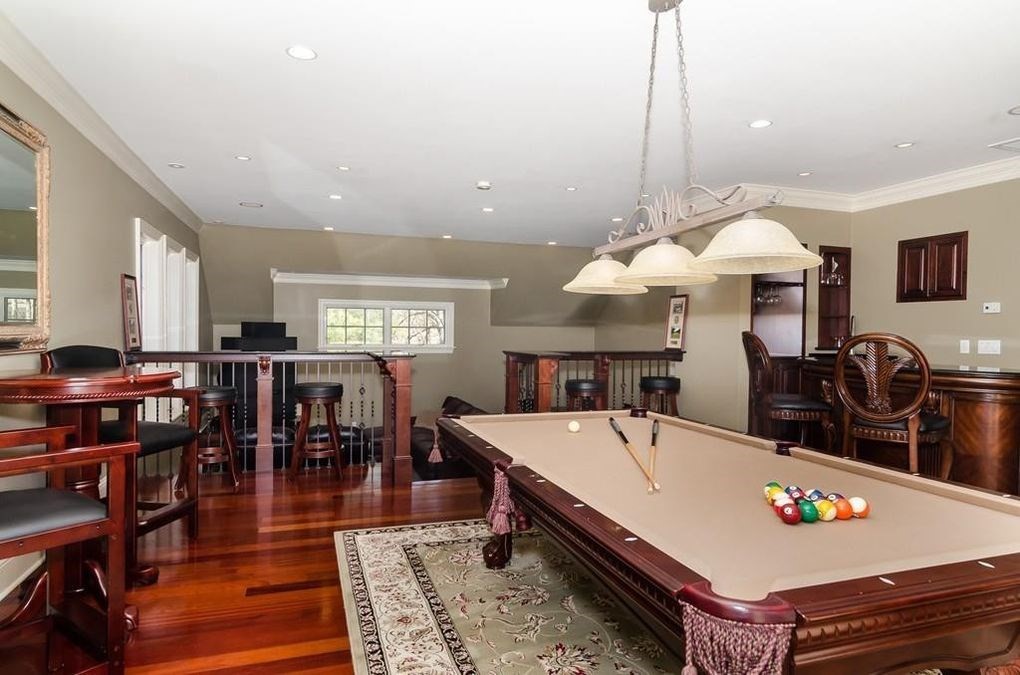 56 Sears Road Southborough, MA 01772 - Photo 16 of 26 a large kitchen with a table and chairs