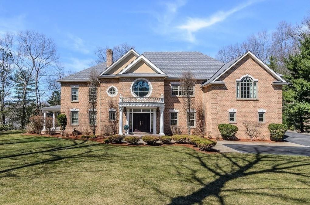 56 Sears Road Southborough, MA 01772 - Photo 18 of 26 a front view of a house with a yard