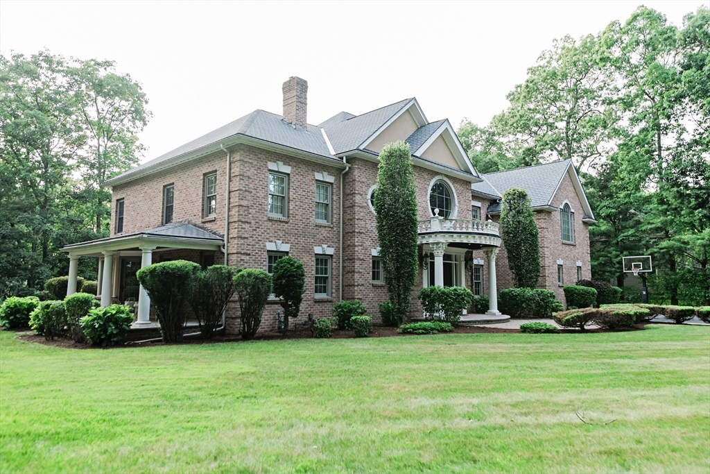 56 Sears Road Southborough, MA 01772 - Photo 19 of 26 a front view of a house with a garden
