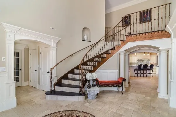 a view of entryway and hall with dining room