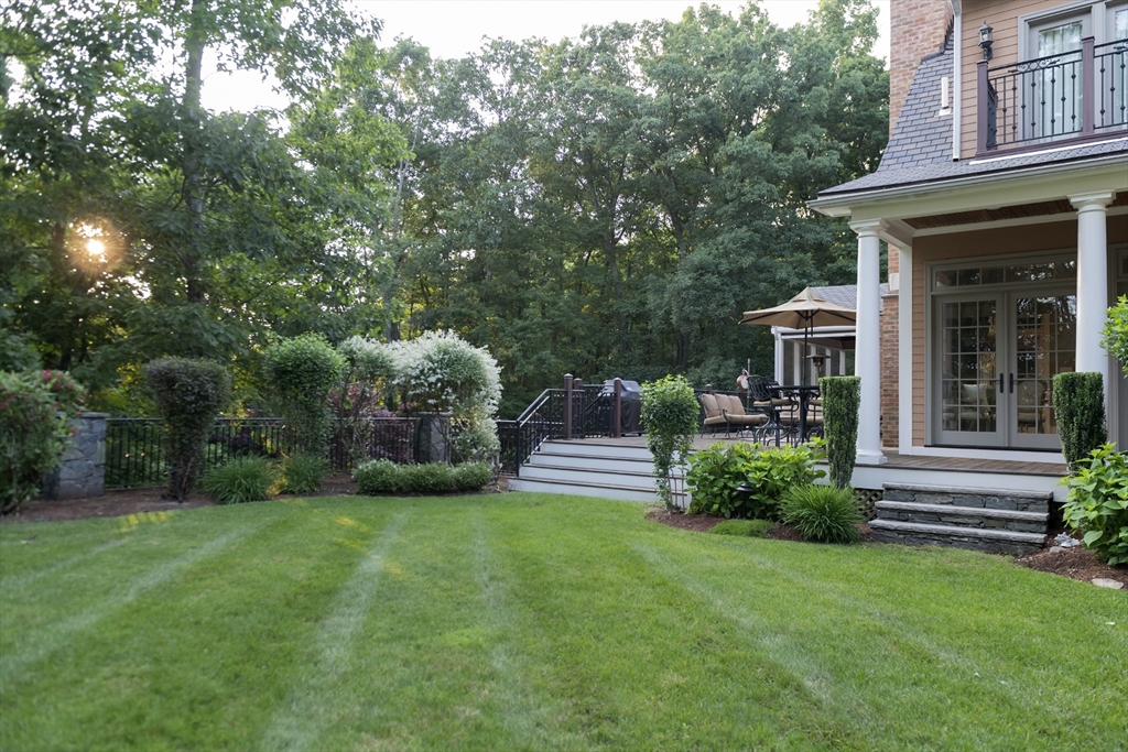 56 Sears Road Southborough, MA 01772 - Photo 22 of 26 a view of a house with a yard and sitting area