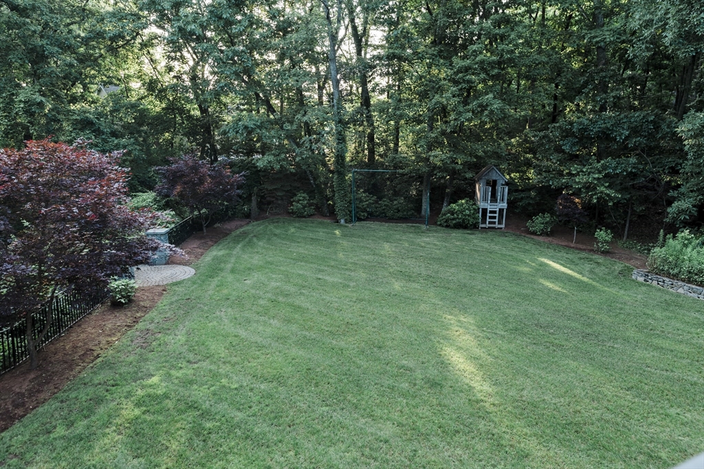 56 Sears Road Southborough, MA 01772 - Photo 25 of 26 a view of a backyard with large trees